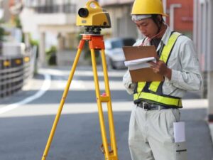 Land surveyor collecting site data for an office building conversion in Washington DC