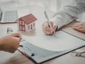 Home buyer reviewing property closing documents for a loan closing survey in Washington DC.