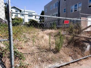 Vacant urban property being reviewed for a subdivision survey to combine record lots in Washington DC